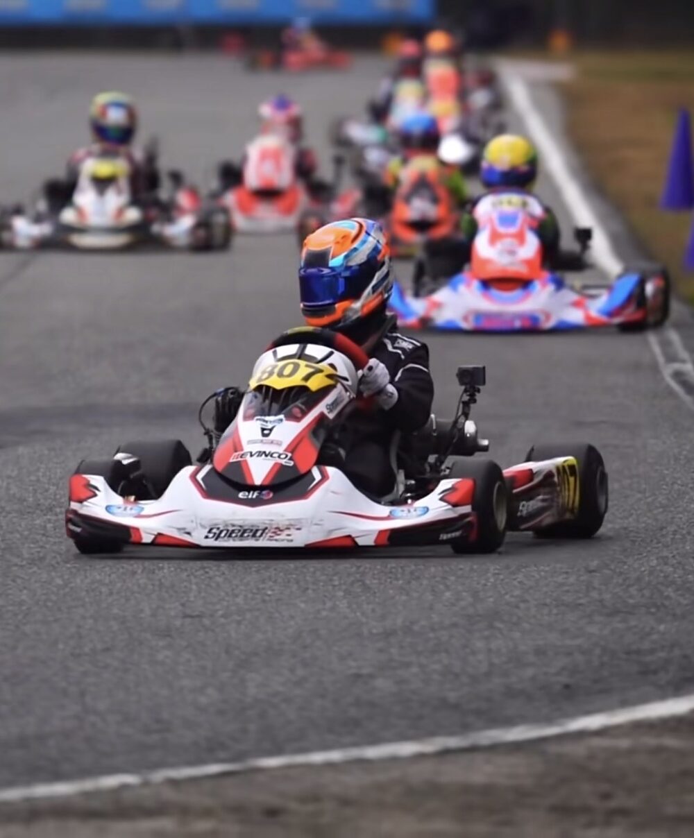 Tucker Trieb leading a pack of karts